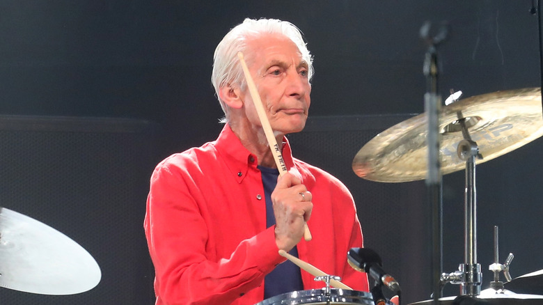 Charlie Watts playing drums on stage