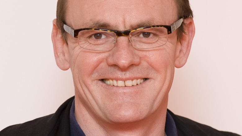 Sean Lock smiles at an event