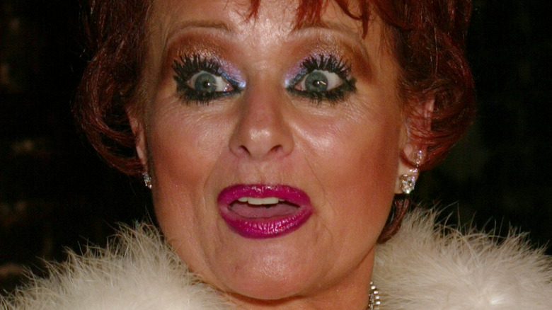 Tammy Faye Bakker with surprised expression and bright makeup in 2002