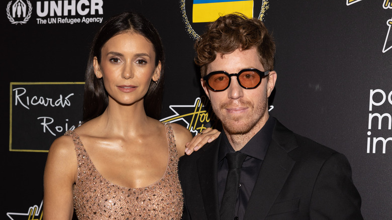 Nina Dobrev and Shaun White pose at the With Love For Peace gala