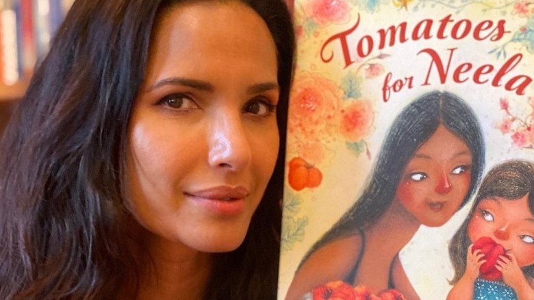 Padma Lakshmi holding her book