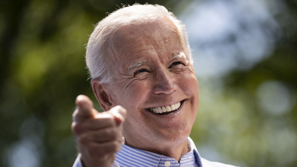 Joe Biden smiling and pointing