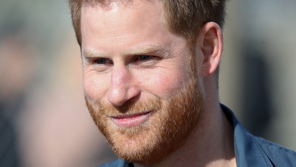 Prince Harry smiling outside