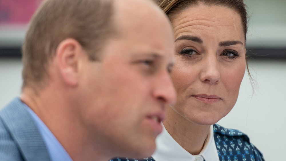 Prince William and Kate Middleton staring