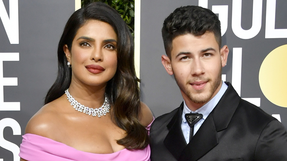 Priyanka Chopra and Nick Jonas posing together on the red carpet