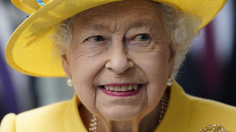 Queen Elizabeth II wearing yellow