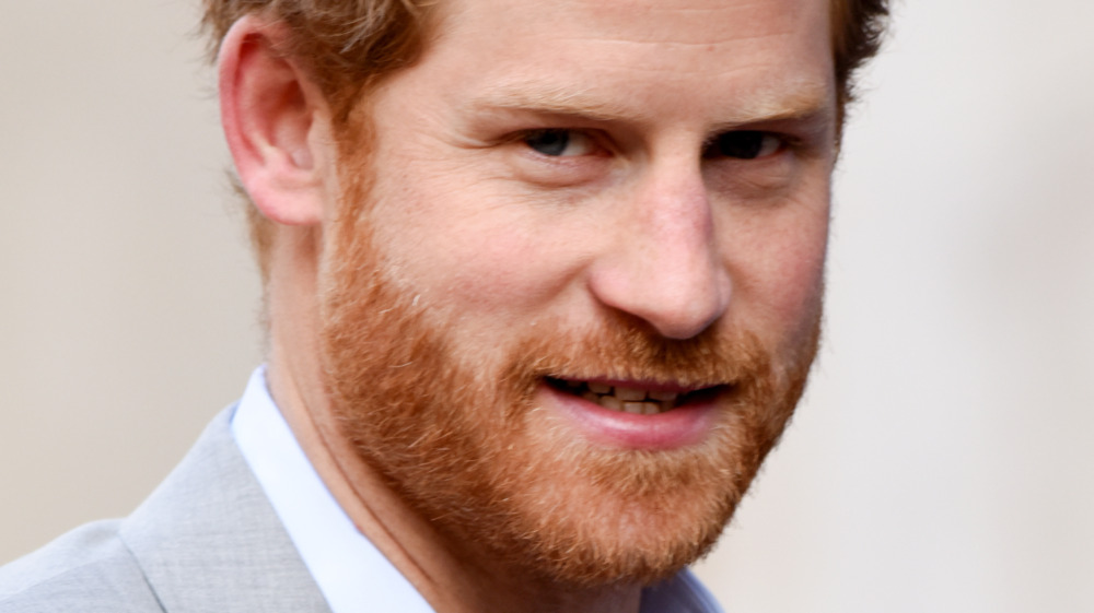 Prince Harry with a neutral expression