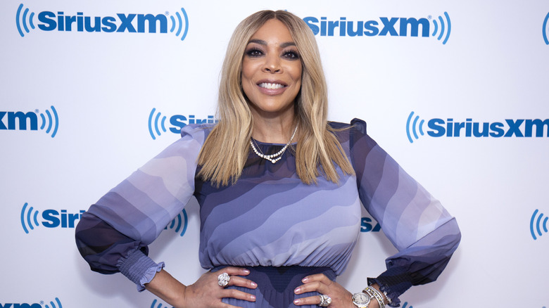 Wendy Williams posing with her hands on her hips.