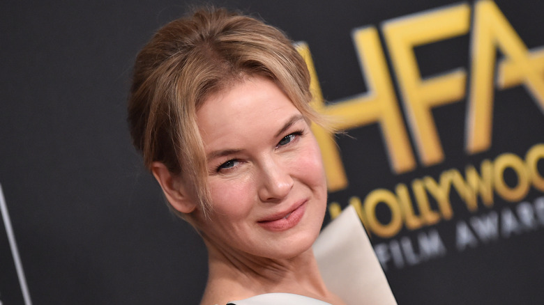 Renee Zellweger poses with hair pulled back