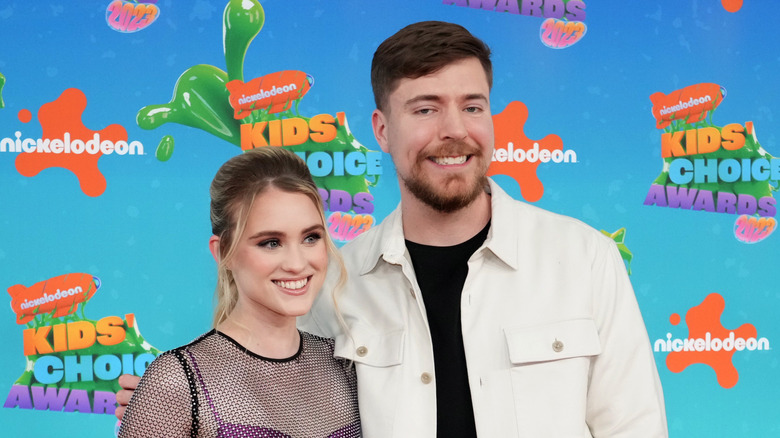Thea and Mrbeast posing together.