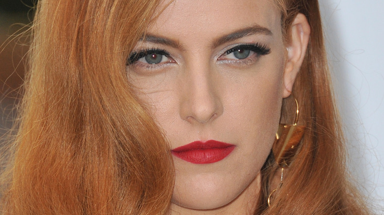 Riley Keough with a neutral expression