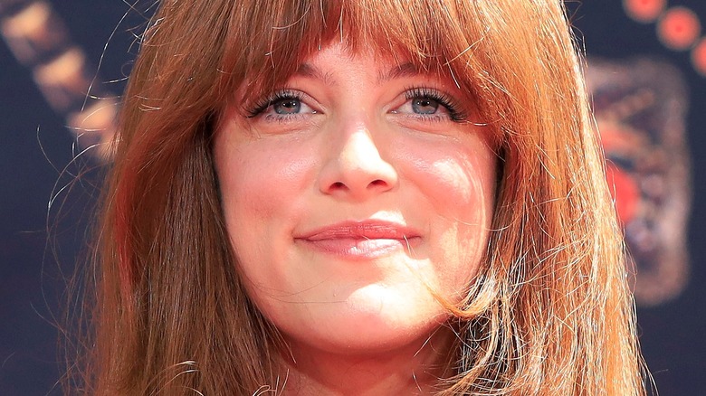 Riley Keough poses with bangs and hair down