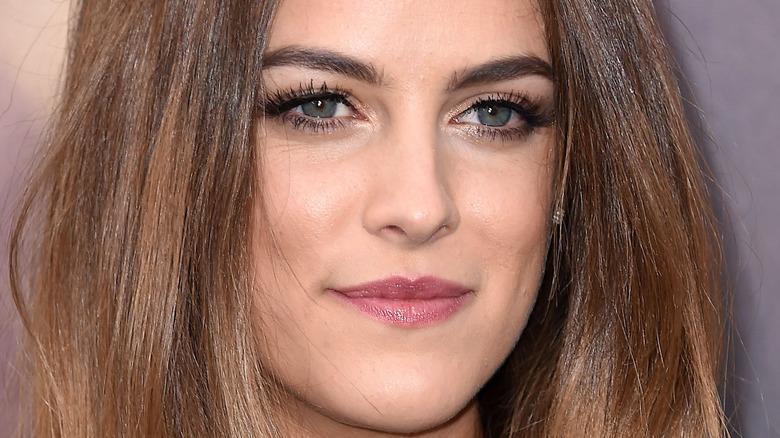 Riley Keough poses for photo at premiere