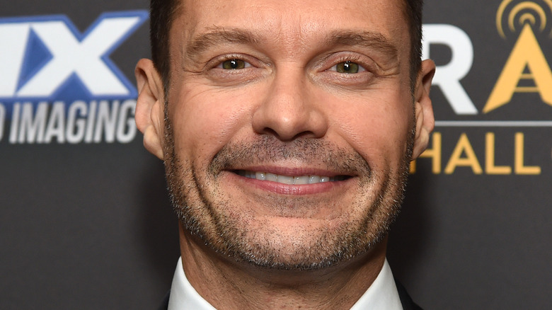 Ryan Seacrest poses on the red carpet