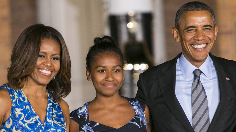 Michelle, Sasha, and Barack Obama smiling