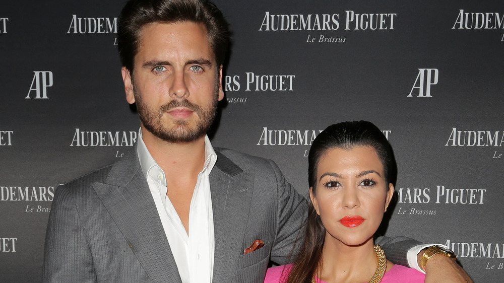Scott Disick and Kourtney Kardashian posing