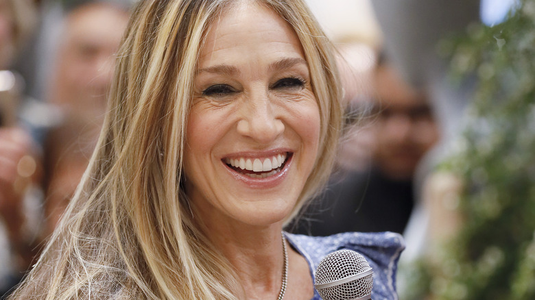 Sarah Jessica Parker holding a microphone