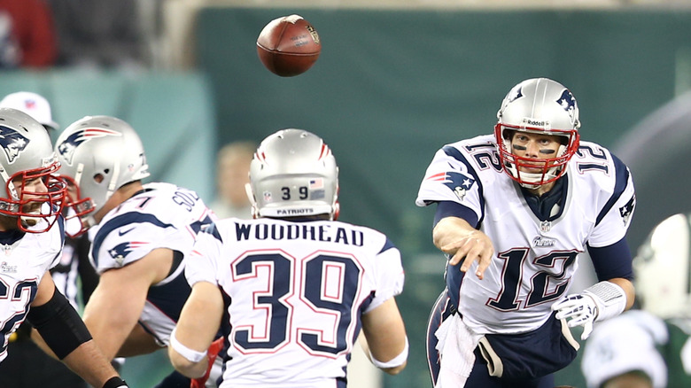 Tom Brady playing football