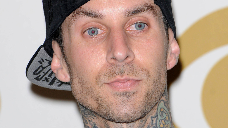 Travis Barker with a serious expression