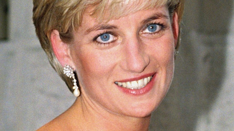 Princess Diana smiling with drop earrings