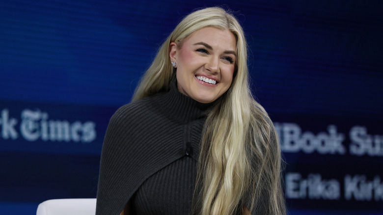 Erika Kirk smiling onstage.