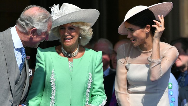 The Duke and Duchess of Cornwall and Meghan Markle