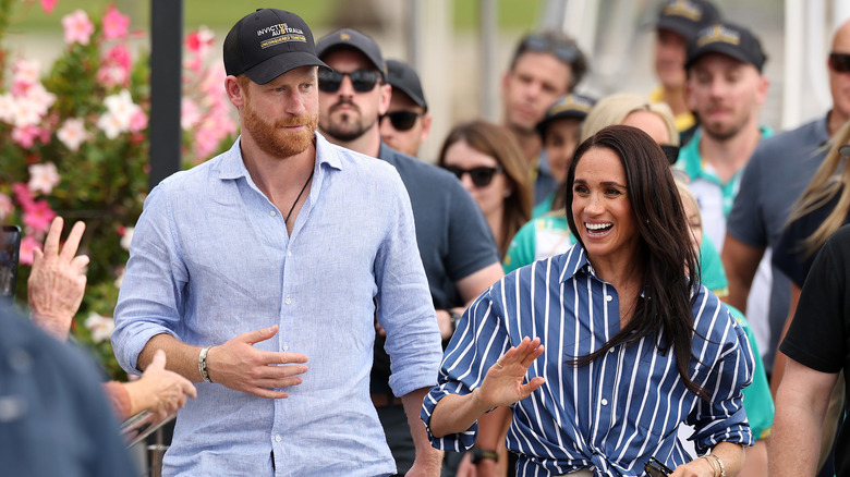 Prince Harry and Meghan Markle walking together.