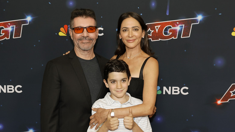 Simon Cowell and Lauren Silverman pose with their son, Eric, in 2023.