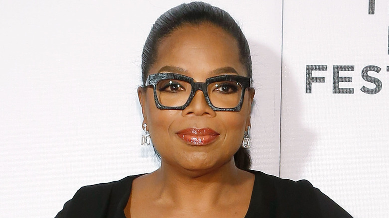 Oprah Winfrey posing, wearing glasses