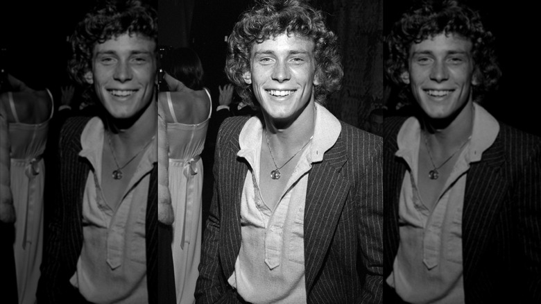 Young Willie Aames smiles in a black and white photo