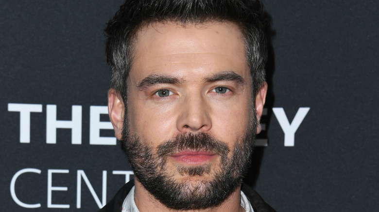 Charlie Weber posing
