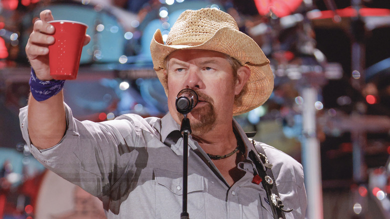 Toby Keith holding red cup