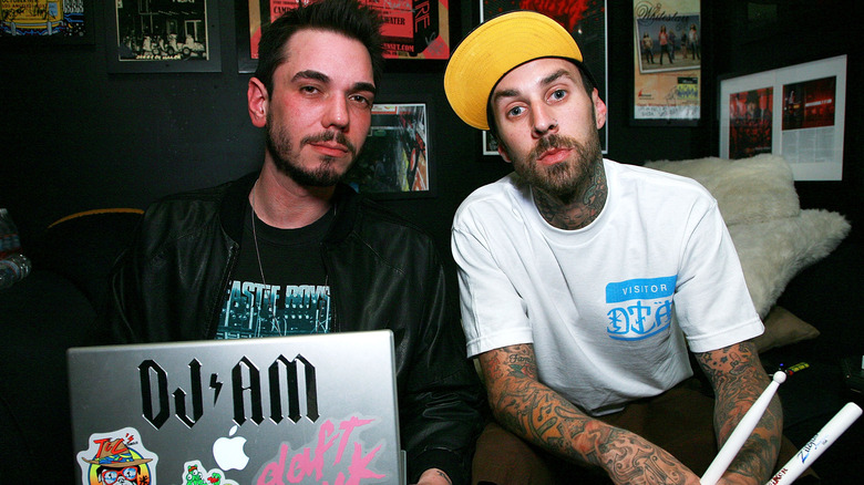 DJ AM and Travis Barker sit together
