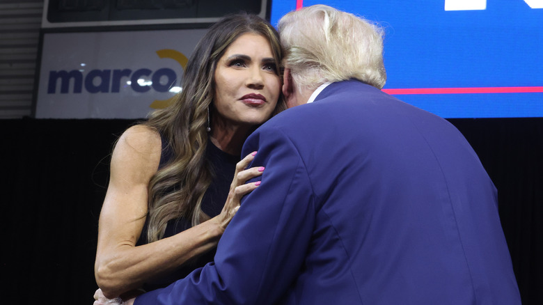 Kristi Noem and Donald Trump at a rally