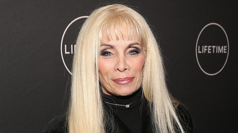 Victoria Gotti black turtleneck