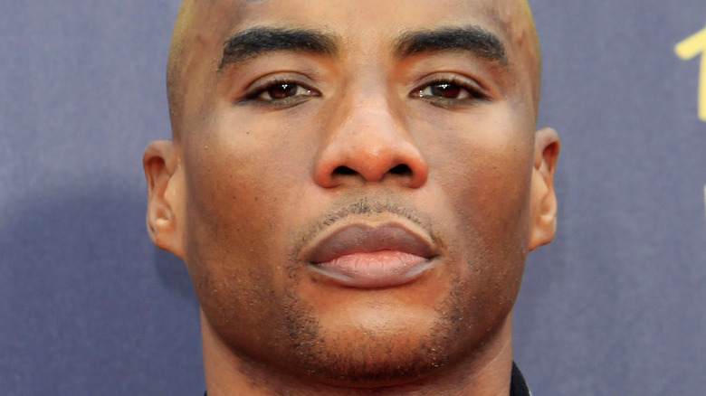 Charlamagne tha God stares at the camera during an event