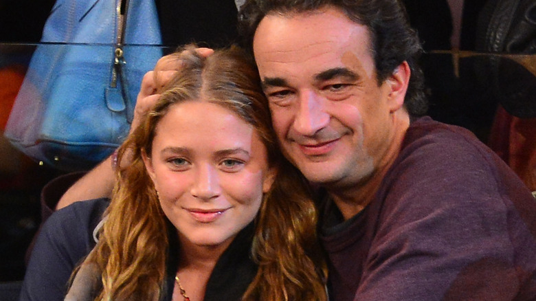 Mare-Kate Olsen and Olivier Sarkozy watch a game