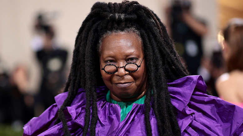 Whoopi Goldberg wearing purple