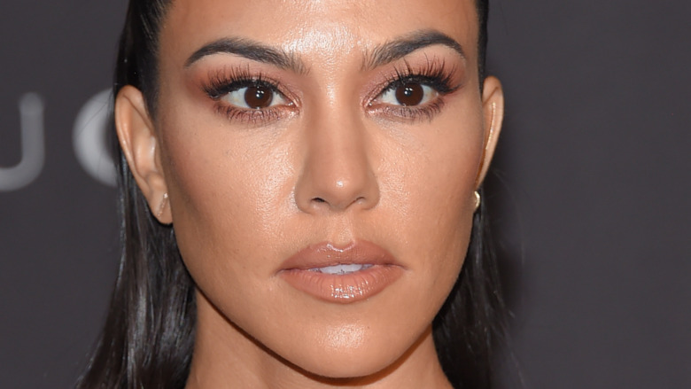 Kourtney Kardashian gives a menacing look on the red carpet