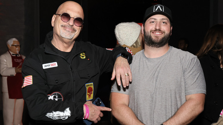 Howie Mandel points to his son Alex Mandel at an event.