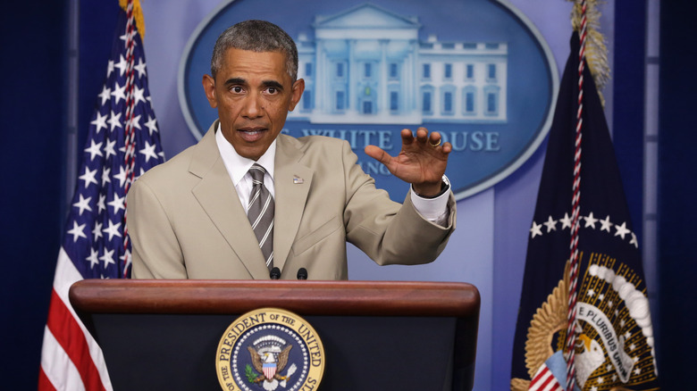 Barack Obama speaks in a tan suit in August 2014