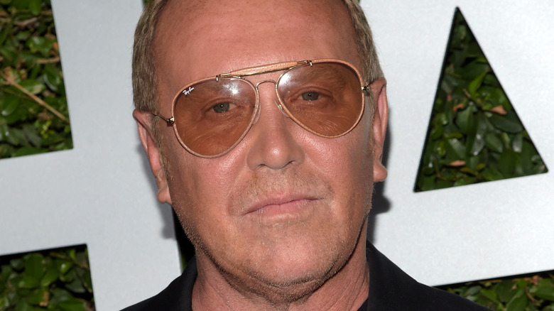 Michael Kors wearing sunglasses at event