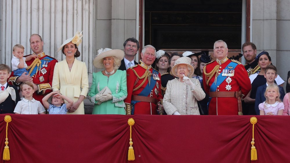 The royal family watch a flypast from the balcony of Buckingham Palace during Trooping The Colour, the Queen's annual birthday parade in 2019 