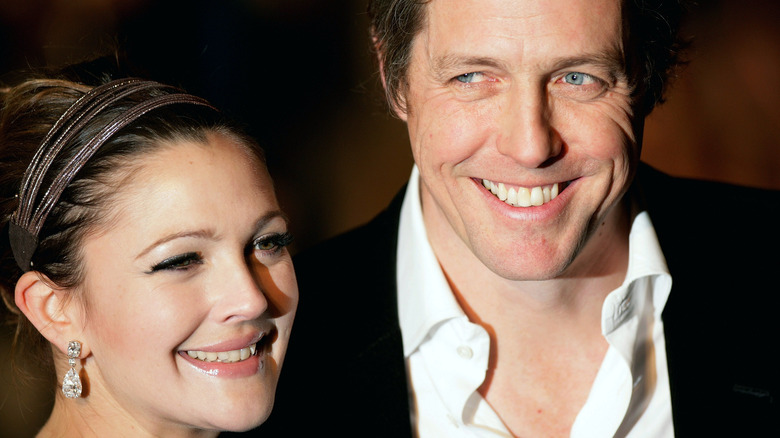 Drew Barrymore and Hugh Grant smiling