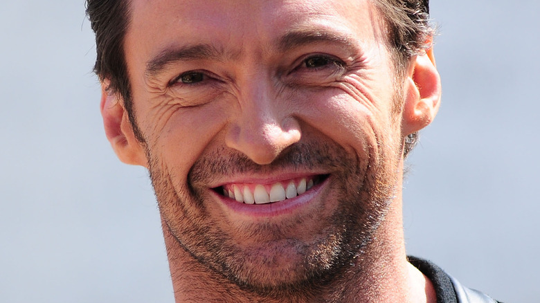 Hugh Jackman smiles at a photo call