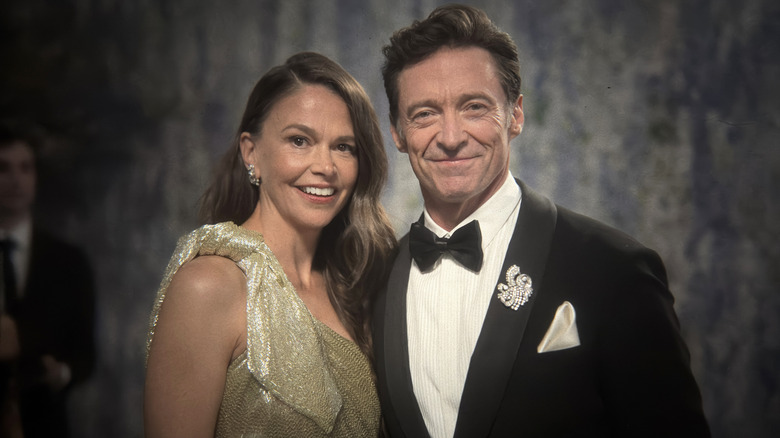 Hugh Jackman in a tux and Sutton Foster wearing a gold dress at the 2026 Met Gala.