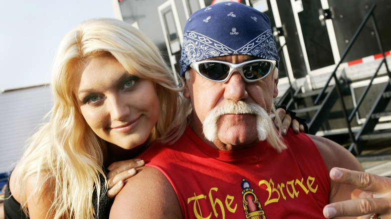 Brooke and Hulk Hogan posing together.
