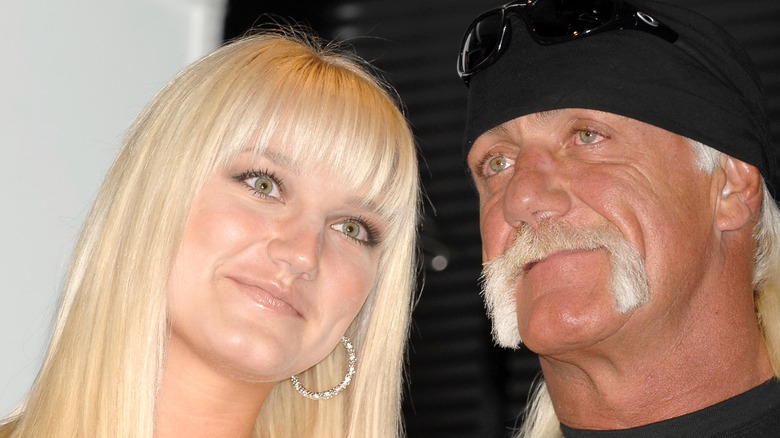 Brooke Hogan posing with Hulk Hogan