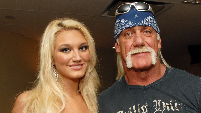 Brooke Hogan posing with Hulk Hogan