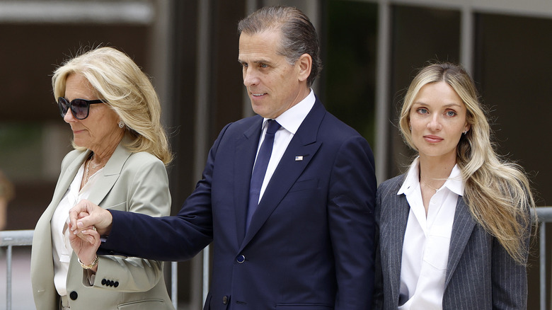 Jill, Hunter, and Melissa Cohen Biden holding hands 